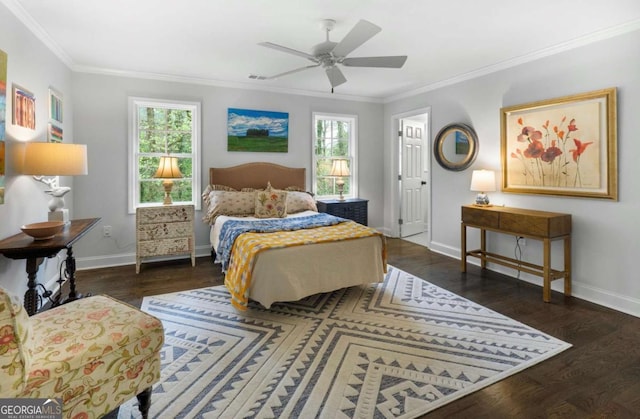 bedroom featuring multiple windows, ceiling fan, and ornamental molding