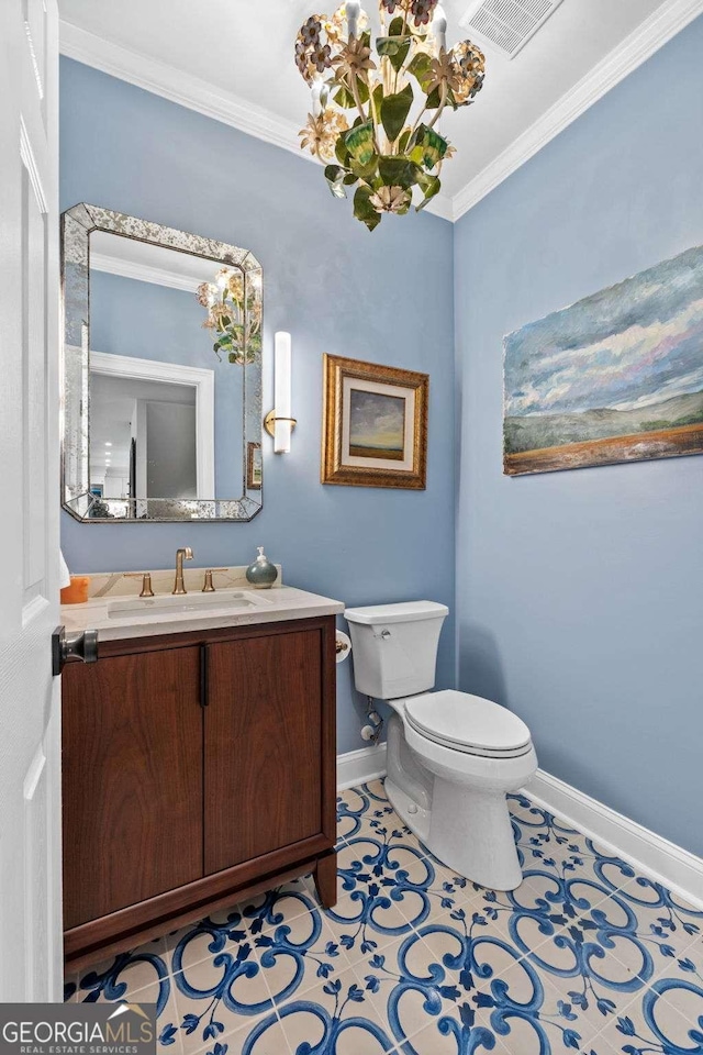 bathroom featuring visible vents, baseboards, toilet, ornamental molding, and tile patterned floors