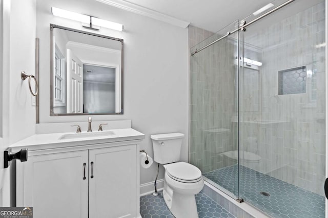 bathroom featuring toilet, a stall shower, ornamental molding, tile patterned flooring, and vanity