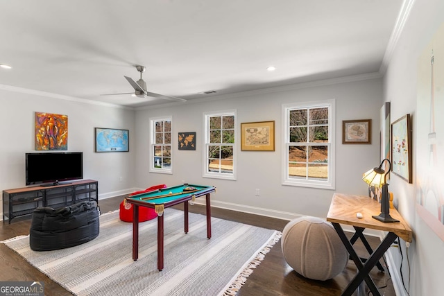 recreation room featuring a ceiling fan, dark wood-style floors, recessed lighting, crown molding, and baseboards