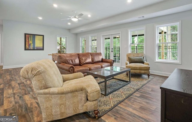 living room featuring ceiling fan, dark hardwood / wood-style flooring, and french doors