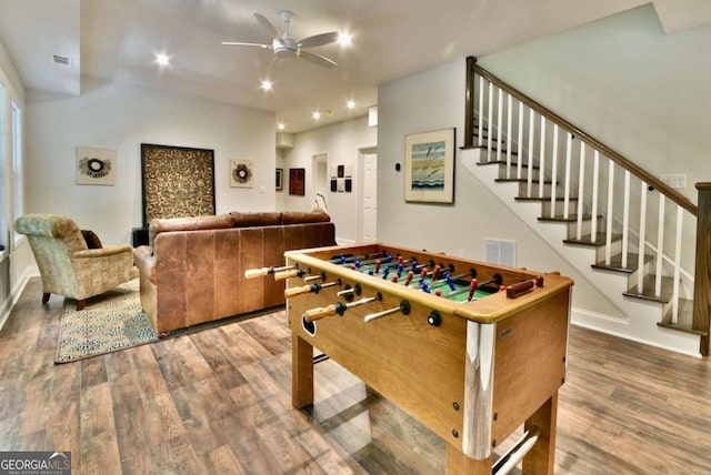 rec room with wood-type flooring and ceiling fan