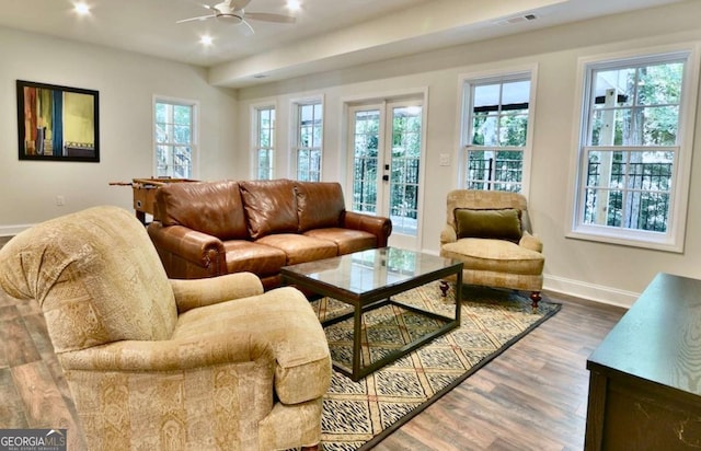 living room featuring ceiling fan, french doors, and wood-type flooring