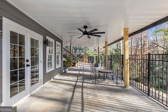 deck with french doors and a ceiling fan