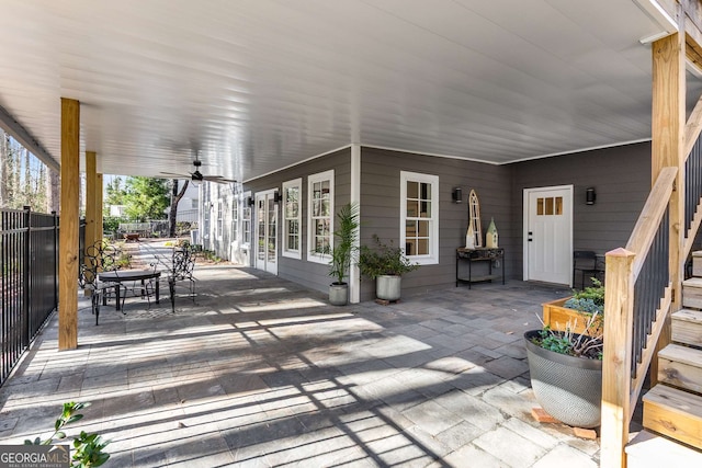 view of patio / terrace featuring outdoor dining area, a ceiling fan, and fence