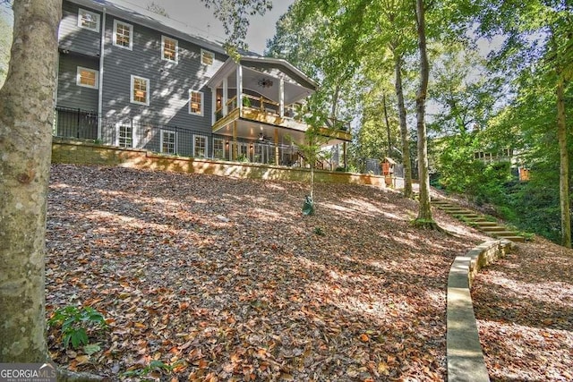 back of house featuring a ceiling fan