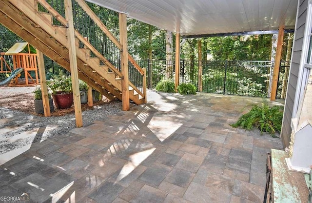 view of patio featuring a playground