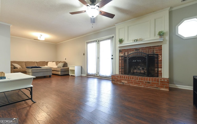 living room featuring a fireplace, crown molding, dark hardwood / wood-style flooring, and ceiling fan