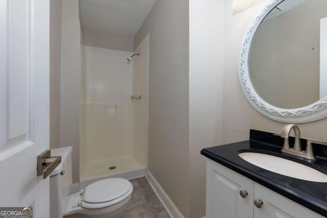 bathroom with a shower, tile patterned flooring, vanity, and toilet