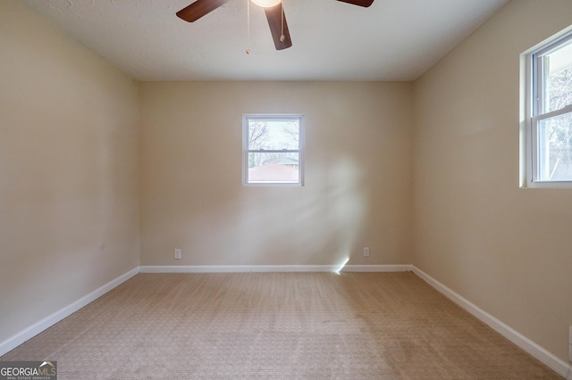 empty room with light carpet and ceiling fan