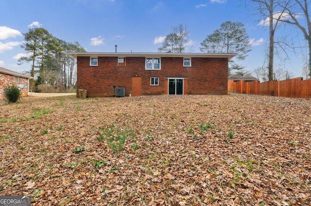 rear view of house with central air condition unit