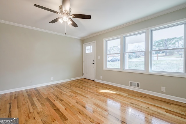 interior space with ceiling fan, light hardwood / wood-style flooring, and ornamental molding