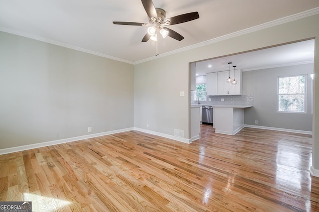 unfurnished living room featuring ceiling fan, light wood-type flooring, and crown molding