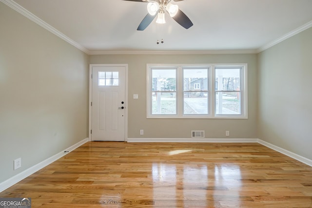 entrance foyer featuring ceiling fan, light hardwood / wood-style flooring, and ornamental molding