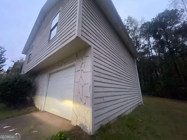 view of side of property featuring a garage