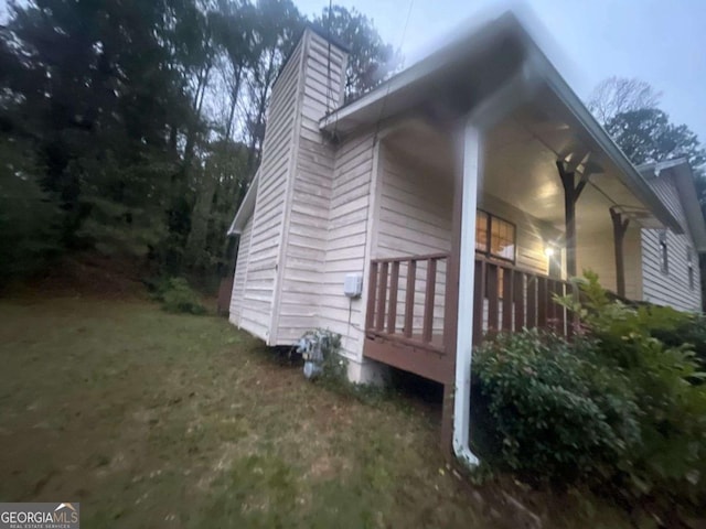 view of side of property with a porch