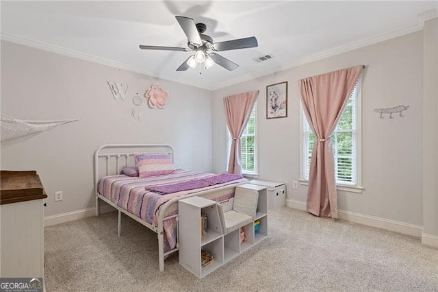 bedroom with ornamental molding, light colored carpet, visible vents, and baseboards