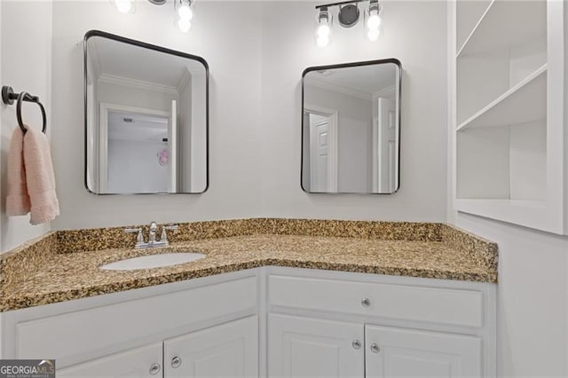 bathroom with ornamental molding and vanity