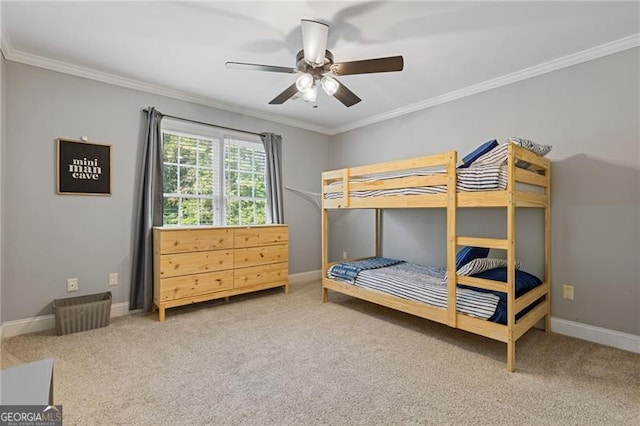 bedroom with ceiling fan, ornamental molding, carpet, and baseboards