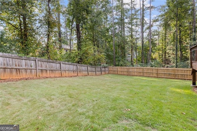 view of yard with a fenced backyard