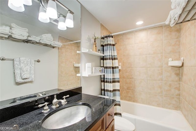 full bathroom featuring vanity, toilet, and shower / bath combo