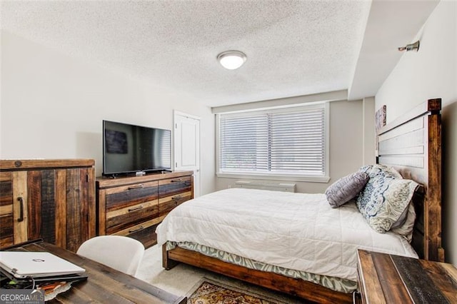 bedroom featuring a textured ceiling