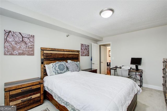 carpeted bedroom with a textured ceiling