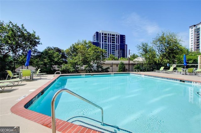 view of swimming pool featuring a patio