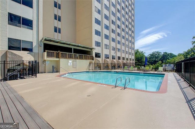 view of swimming pool featuring a patio