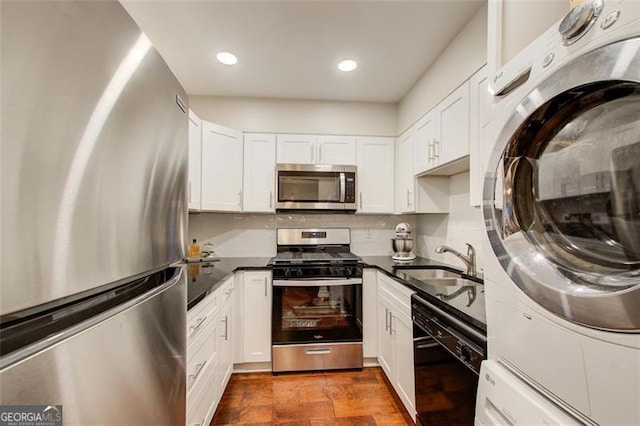 kitchen with sink, white cabinets, and stainless steel appliances