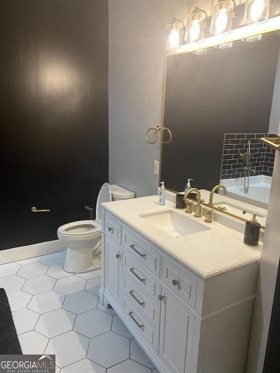 bathroom with vanity and toilet