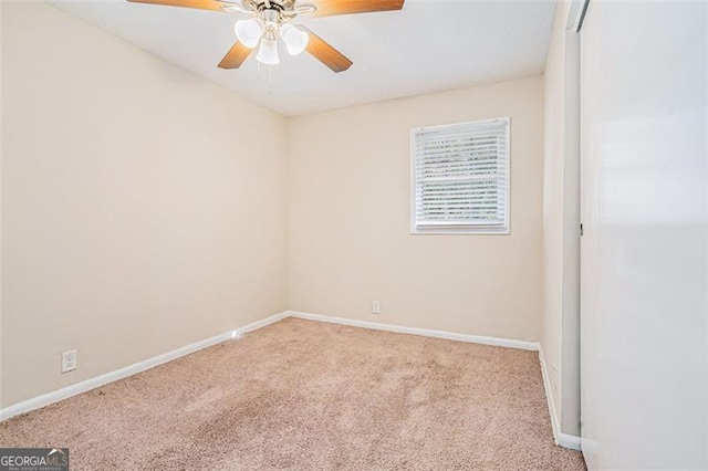 unfurnished room with ceiling fan and light colored carpet