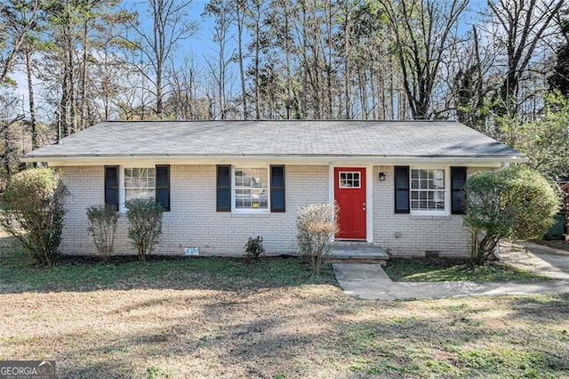 ranch-style house with a front lawn