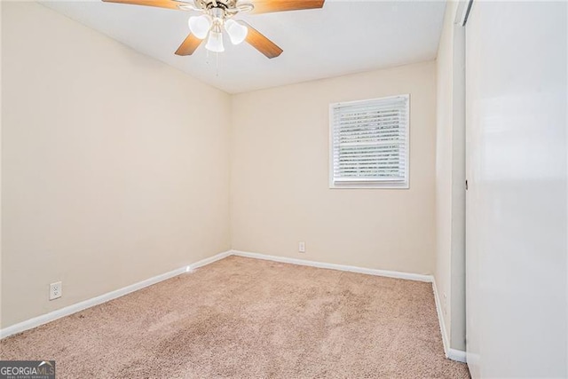 unfurnished room featuring ceiling fan and light carpet