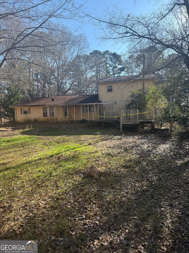 back of property with a yard