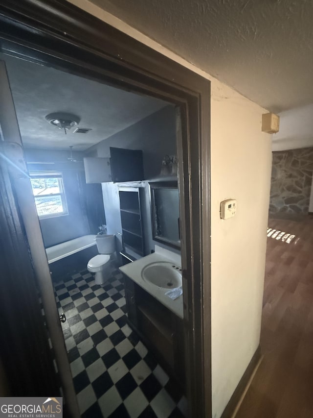 full bathroom with vanity, toilet, and bathing tub / shower combination