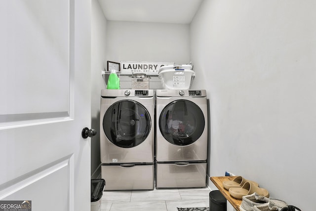 washroom with independent washer and dryer