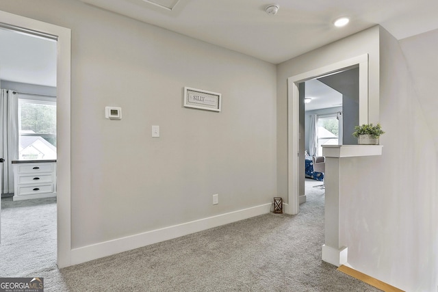 hallway with carpet flooring