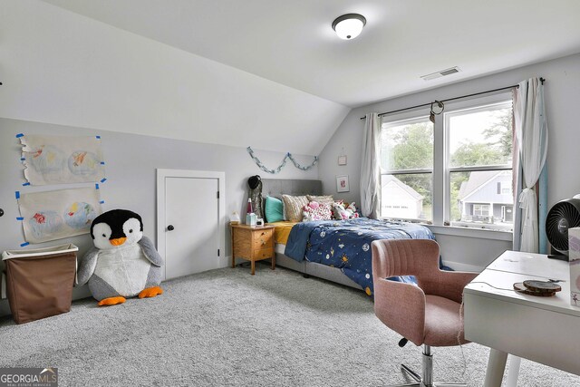 carpeted bedroom with vaulted ceiling