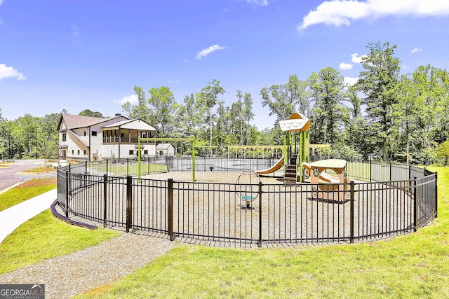 view of jungle gym featuring a lawn