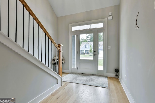 foyer with a healthy amount of sunlight and light hardwood / wood-style flooring