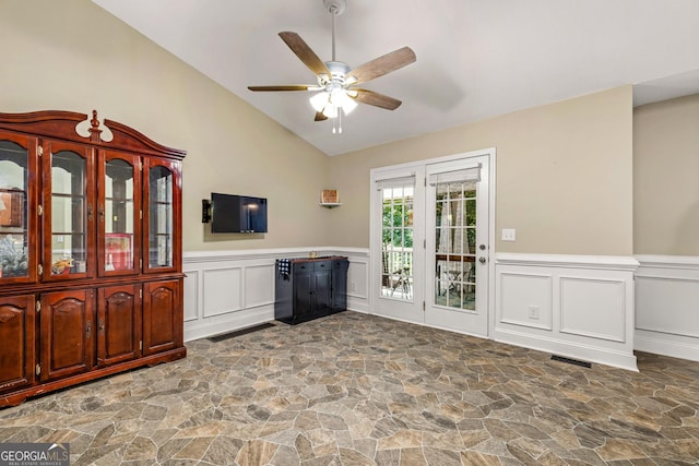 interior space featuring ceiling fan and vaulted ceiling