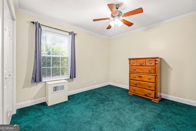 carpeted empty room with ceiling fan and ornamental molding