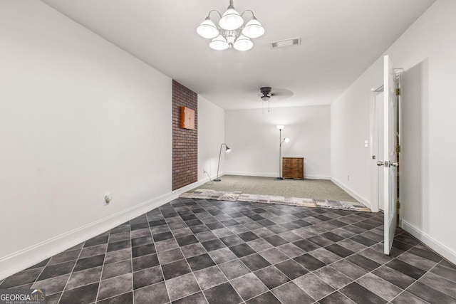 unfurnished living room featuring ceiling fan with notable chandelier