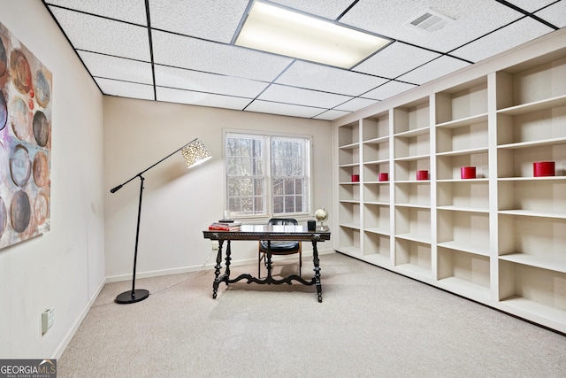 miscellaneous room with carpet floors and a paneled ceiling