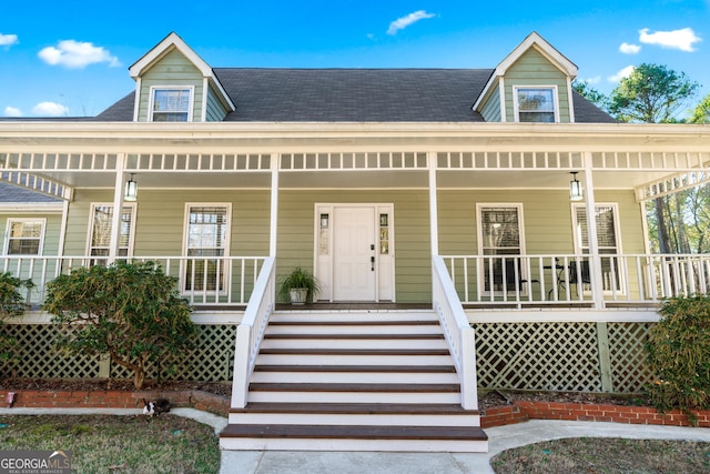 new england style home with covered porch