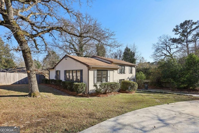 view of property exterior with a lawn