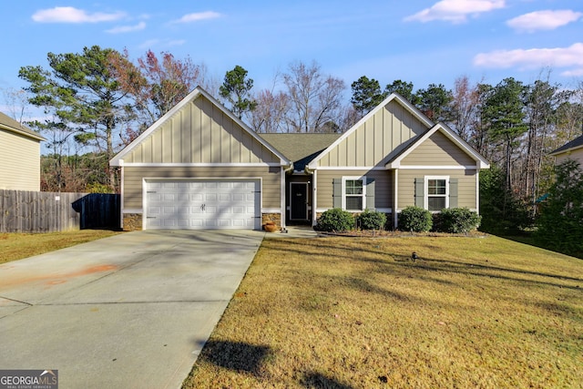 view of front of home featuring a garage and a front yard