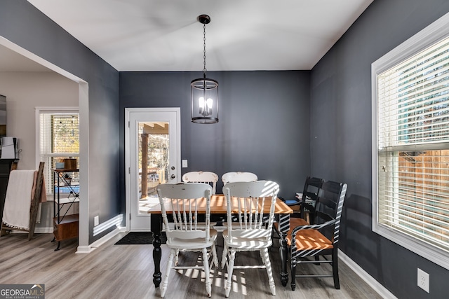 dining space featuring a chandelier and hardwood / wood-style flooring