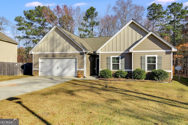 view of front of house with a garage and a front lawn